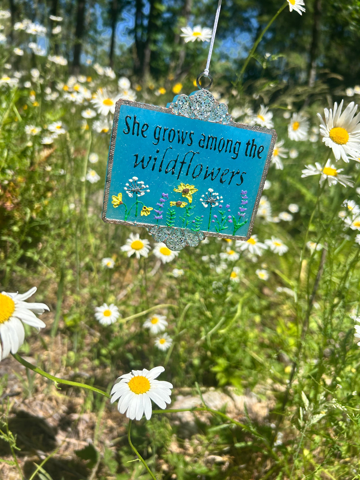 She grows among the wildflowers