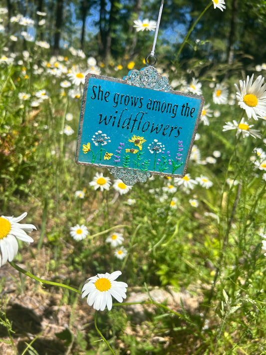 She grows among the wildflowers